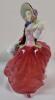 Royal Doulton " Autumn Breezes " Figurine , HN 1934 . Measures 7 &frac34;" tall . No chips or cracks . Minor wear to elbow . - 2