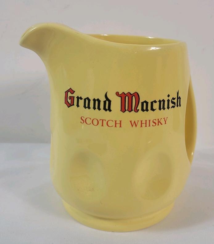 Grand Macnish Scotch Whisky Ceramic Water Jug . Measures 5.5" tall . No chips or cracks .