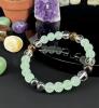 Green & Brown 8mm Bead Flex Bracelet with Black Serene Mint-Green Center & Clear Beads Mental Balance & Calming Eudaimonia Chain Stock photos added - 2