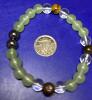 Green & Brown 8mm Bead Flex Bracelet with Black Serene Mint-Green Center & Clear Beads Mental Balance & Calming Eudaimonia Chain Stock photos added - 4