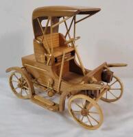 Wooden Handmade 1908 Tudhope McIntyre Car . Canadian Artist in Orillia . Number #03/99 . Back wheel alittle loose . Measures 5"&times;8.5"&times;7.5"