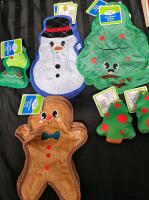 11 new dog toys. 2 gingerbread flattie toys, 2 plush trees, 1 durable tree, 2 snowman flattie toys, 4 tree flattie toys