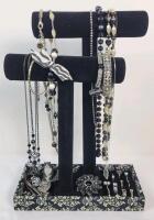 Assorted Rings , Brooches , Bracelets & Necklaces with Jewelry Stand .