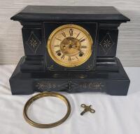 As Is - Antique Ansonia Black Cast Iron Mantle Clock w/Key . Patented June 1881 . Chimes on the Hour & Half Hour , Pendulum Swings , Mechanism on Face Rotates , Key Mechanism on Clock Face both Rotate . Face Door Needs Replacing & Needs New Clock Arms . H