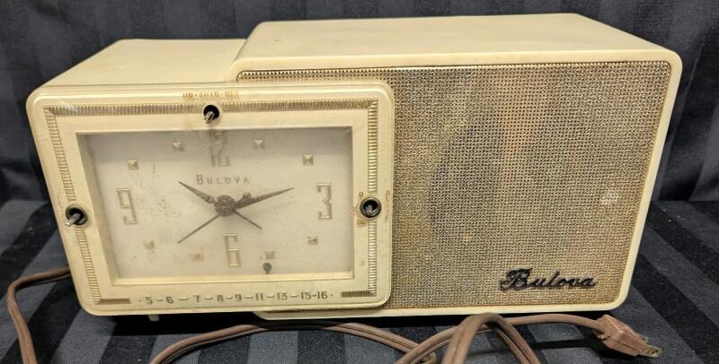 Vintage Bulova Clock Radio. Clock Turns When Plugged In. Knobs Missing, Unable to test. 11.5" Wide