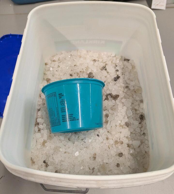 Approximately 14kg (including container weight) if sidewalk salt. Container measures 11.5" Tall