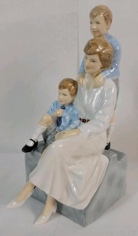 Royal Doulton " Remembering Diana , Princess of Wales - A Loving Mother " Figurine , HN 5857 . Signed on Bottom . Measures 8.5" tall . No chips or cracks