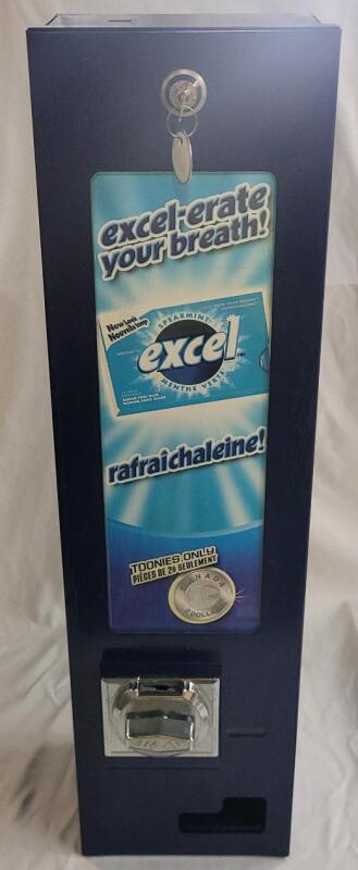 Beaver Excel Gum Vending Machine w/Key . Will Accept Toonies Only . Can Hold Packs of Gum 2.5"&times;4 ⅜" . Machine measures 7 &frac14;"&times;27 ⅛"&times;5.5" .