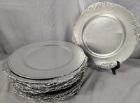25 Plastic Charger Plates. Approximately 13" Across. Various patterns