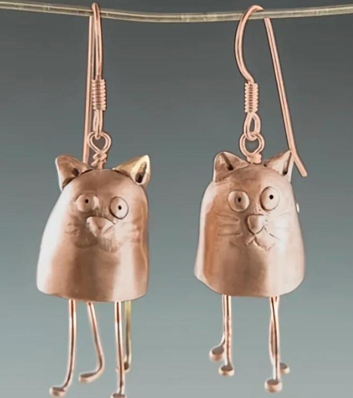 Vintage Inspired Cat Earrings Hand-Carved Copper Hoops with Black Etched Face Intricately Carved Cat-Shaped Earrings Sheppard Hooks approximately 1.5&rsquo;&rsquo; drop. Little paws hang down stock photos added