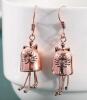 Vintage Inspired Cat Earrings Hand-Carved Copper Hoops with Black Etched Face Intricately Carved Cat-Shaped Earrings Sheppard Hooks approximately 1.5&rsquo;&rsquo; drop. Little paws hang down stock photos added - 3