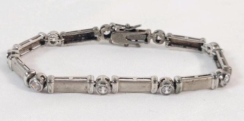 Vintage Sterling Silver Bracelet w/9 Stones . Stamped 925 . Measures 6.5" long .
