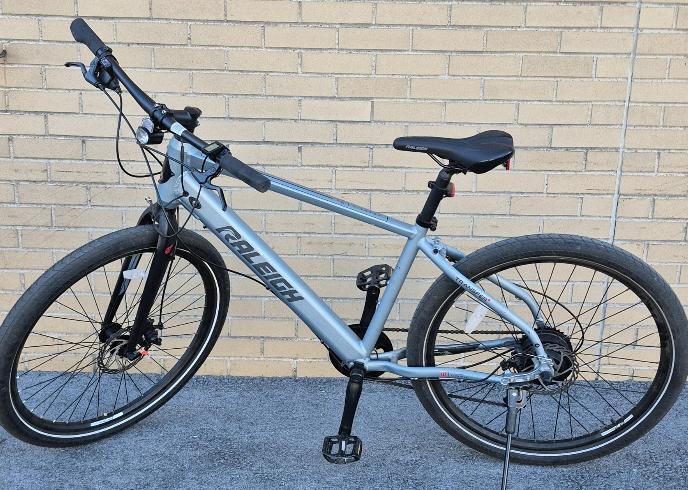 Raleigh Transit Urban Electric Bike with Front & Rear Lights, 27.5-in Wheel, Grey Retails New for $2199.99 [See Desc]