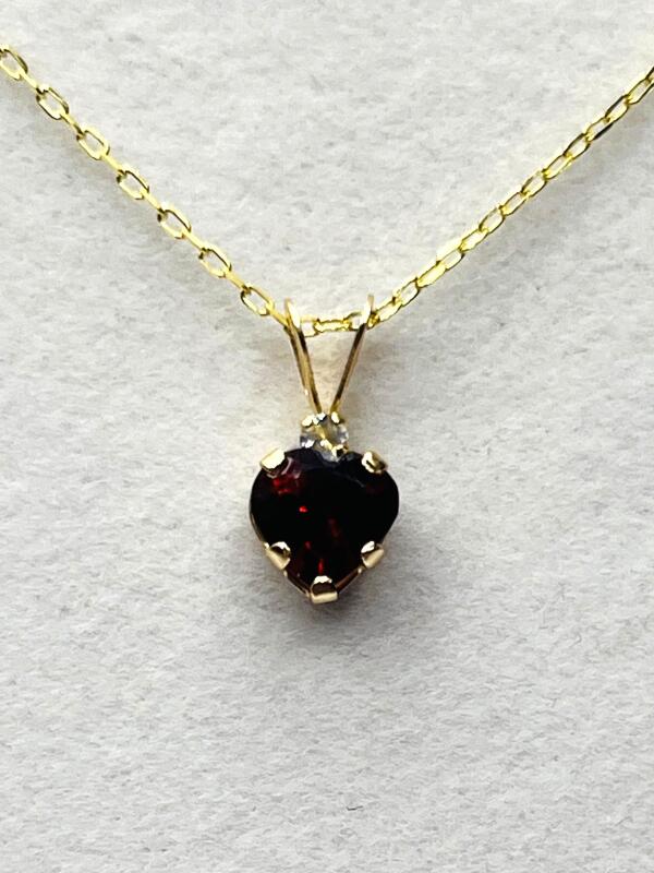 10KT Yellow Gold Natural Garnet Heart Shape Pendant with Gold Plated Sterling Silver Chain, Retail $350.00. Garnet is the birthstone for January.