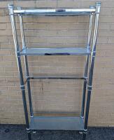 3 Tier Bathroom Shelf with Built In Towel Rack. Approximately 59" Tall. Has lean. See photos