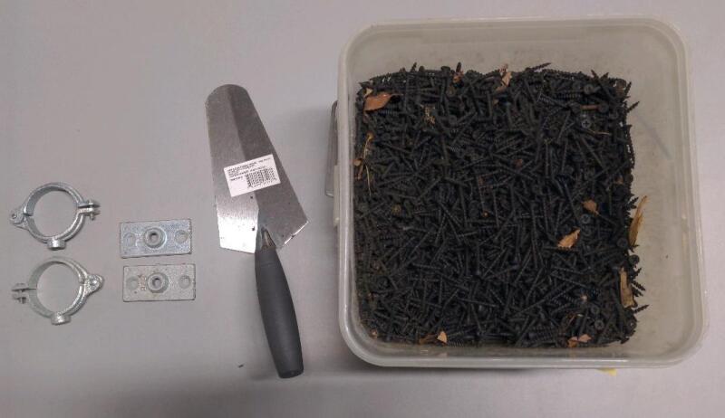 Large Bucket of Black Drywall Screws, Masonry Trowel, and Pipe hanging clamps/mounts