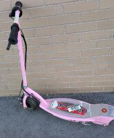 As Is Razor Electric Scooter. Wheels Turn, Breaks Work. No power Cable, Unable to Test. Handle Bar Unsecured. Approximately 35" Tall.