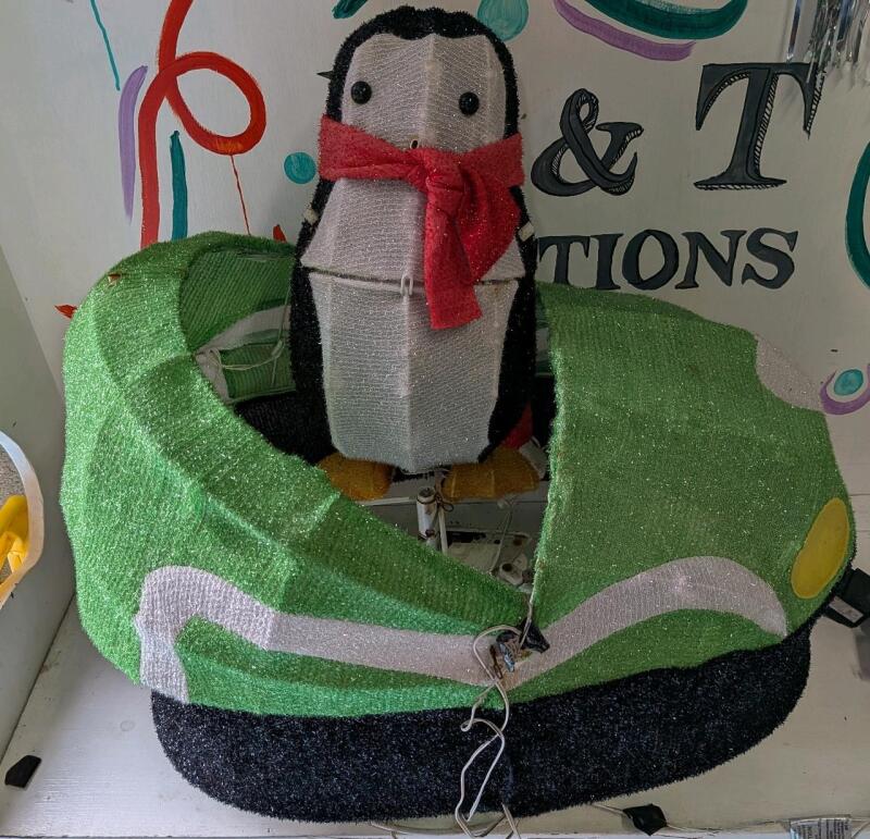 Number can and Penguin Light up Lawn Ornaments. Bumper car stands 19" Tall.