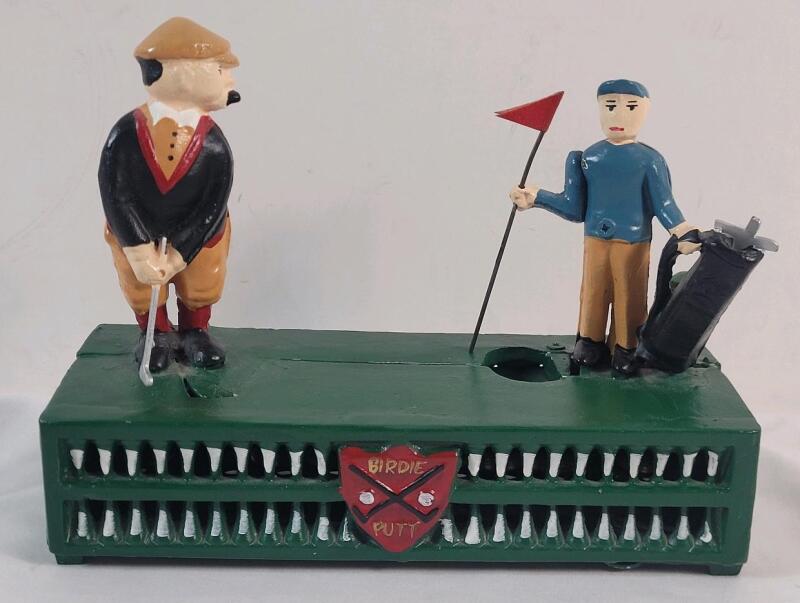 Reproduction Cast Iron Mechanical Golf Coin Bank . Measures 8.5"&times;3"&times;6.5" . Tested Working