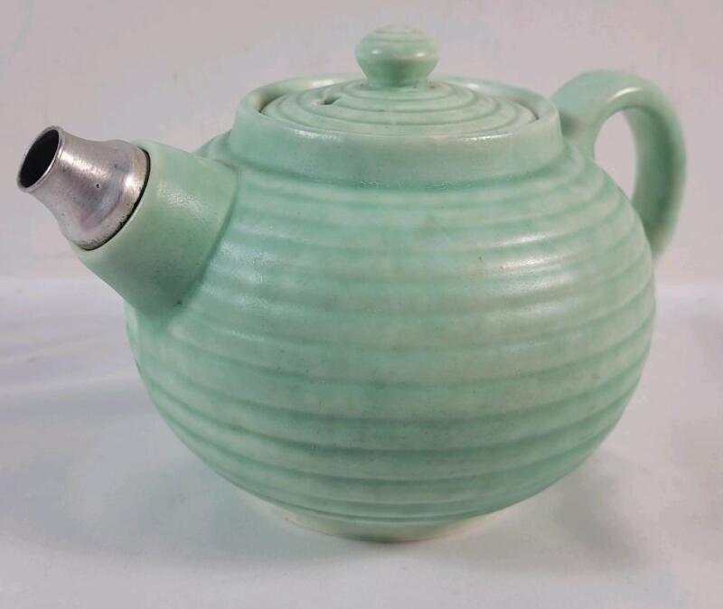 Vintage 1920s - 30s Aladdin Style Pottery Tea Pot w/Metal Spout . Patent # & Makers Hallmark on Bottom . Measures 5.5" diameter & 4 &frac34;" . No chips or cracks