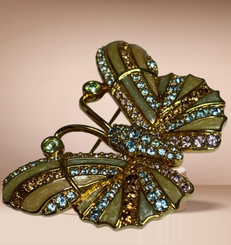 Swarovski Signed Butterfly Brooch set with Multi Color Crystals with Enamel approximately 1.5 x 2&rsquo;&rsquo; One dull stone