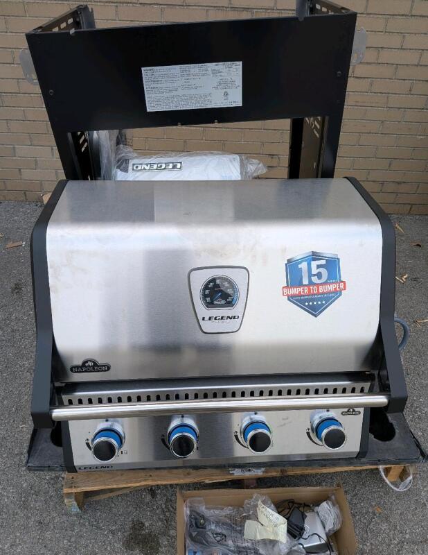 [see Description] As New Napoleon Legend LD4 Stainless Steel 4-Burner Propane Gas BBQ Grill with Folding Side Shelves. Retails for $1100. Complete.