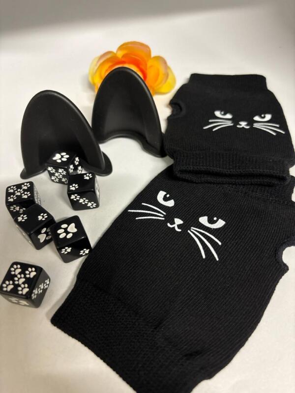 Adorable Cat Ear Shaped Car Mirror Decoration / 6 Black and White Paw Print Dice / Fingeeless Cute Black Cat Gloves stock photo of car mirror decoration