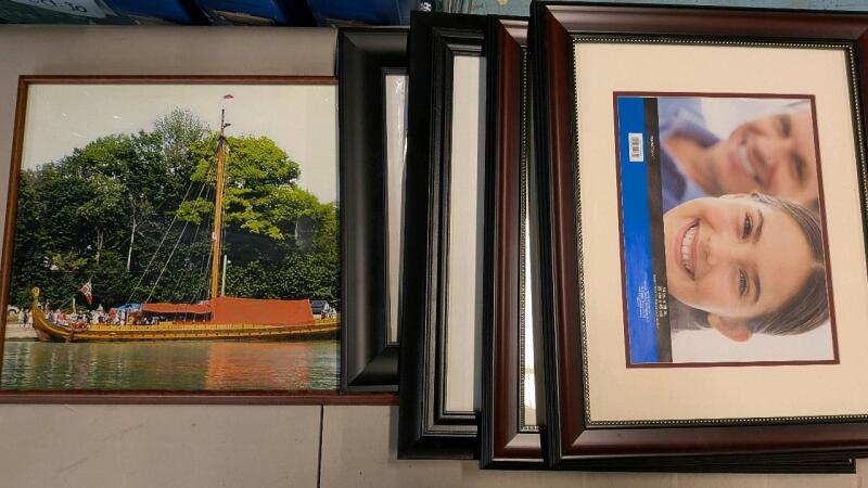 5 Large Pictureframes. One containing photo of a Longboat.