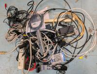 Assorted wires, cables , remotes and power bars.