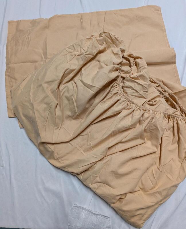 New Pillowcases and Fitted Sheet. Sheet appears to be 80" by 72"