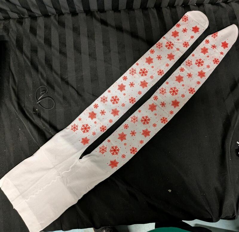 New Holiday Stockings. Measures 40" long Toe to Waist and 8" Across before stretching.