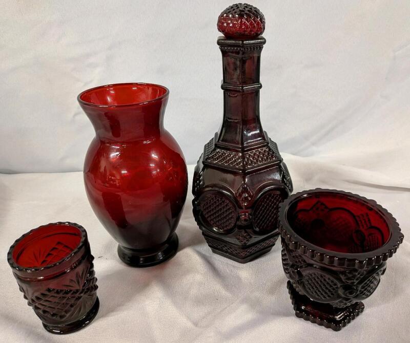 4 Vintage Ruby Glass Pieces. Tallest Piece and Larger Cup Signed Avon. Tallest Measures 8.5" Tall.