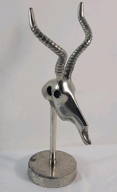 Vintage Polished Metal Antelope Head Sculpture on a Stand . Measures 13 ⅝" tall .