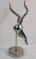 Vintage Polished Metal Antelope Head Sculpture on a Stand . Measures 13 ⅝" tall .