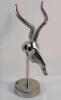 Vintage Polished Metal Antelope Head Sculpture on a Stand . Measures 13 ⅝" tall .