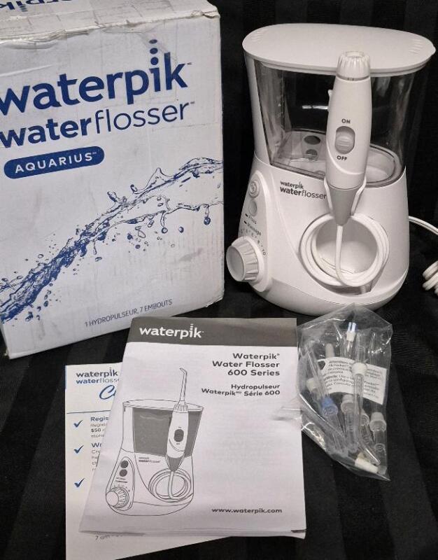 As New in Open Box Waterpik Waterflosser 600 Series Aquarius with 7 Tips