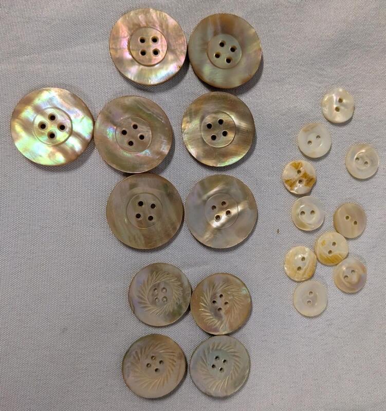 21 Shell Buttons. Larger buttons appear to be Abalone (7 Pink 4 Regular.) largest Button Measures 1.125" Across.