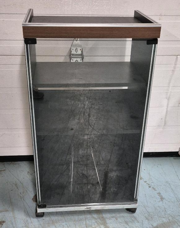 Vintage Stereo Cabinet on Castors. 19.5" by 15.5" by 35". 2 Shelves and place for LP's. Door Magnets still Work.