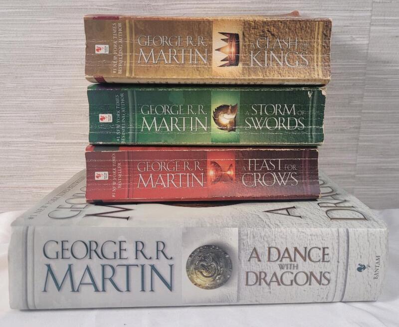 George R R Martin " A Song of Fire & Ice " Book Lot . Clash of Kings , Storm of Swords , Feast for Crows & Dance with Dragons . Four (4) Books . Good Condition
