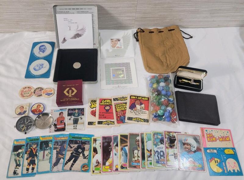 Vintage Junk Drawer Lot . Includes : Hockey & Football Cards , Milk Bottle Caps , Pocket Compass , Stamp / Coin Set , Marbles , Leather Wallet , Ski Tie Clip plus more