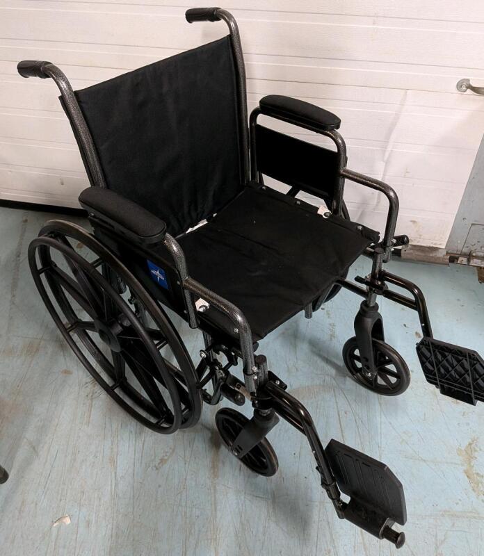 Medline Excel K1 Basic Wheelchair. Rolls Smoothly. Brakes appear to work. 25" by 40" by 36". 20" Seat Height