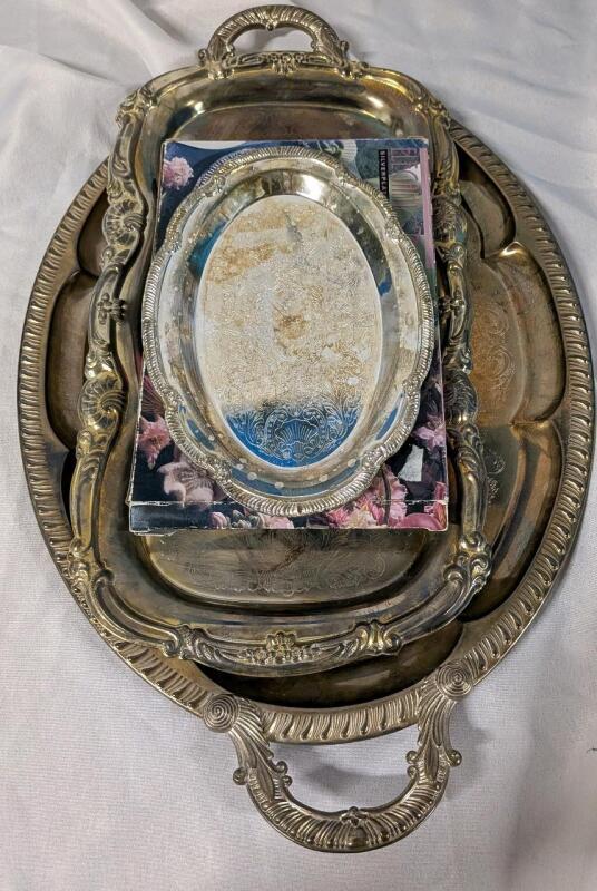 3 Silver plate/metal Platters. Smaller two are silver plate. Larger measures 22" Wide