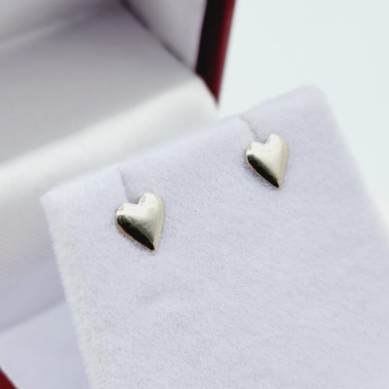 Sterling Silver Heart Shape Earrings, Retail $100.00.