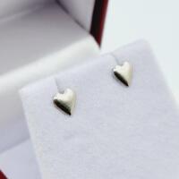 Sterling Silver Heart Shape Earrings, Retail $100.00.