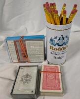 Card Game Night. 4 total decks of cards (unknown if complete) Tin and 19 Pencils.
