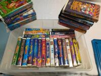 31 Vintage to Newer Disney (and other) VHS. Comes with Bin. Bin Measures 20.5" by 16.5" by 8.5"