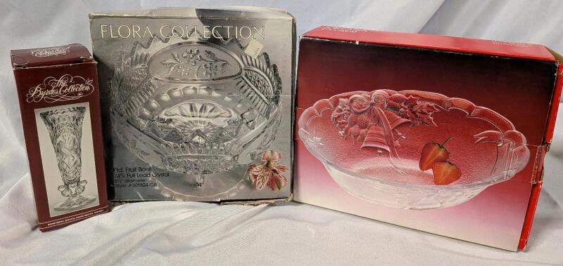 3 Pieces of Crystal In Box. Byrdes Collection Bud Vase (7" Tall), Flora Collection Footed Fruit Bowl (8.5" Diameter) and Mikasa Holiday Bells Oval Bowl. (10")