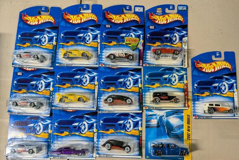 13 Vintage to Newer - New In Box Hotwheels. Assorted Vehicles. All Fords.