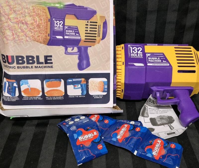 NEW As Is Bubble Machine, Shoots Dozens of Bubbles - No Accessories Included, No Battery. Does Include 10 Packs Bubble Concentrate