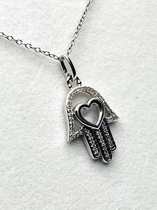 Sterling Silver Natural Diamond (0.11ct) Hamsa Hand with Heart Pendant and Sterling Silver Chain, W/A$500.00. Diamond is the birthstone for April.